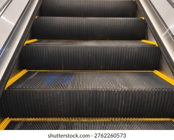 Close Up Escalator Steps Texture with Yellow Safety Lines Modern Urban Detail