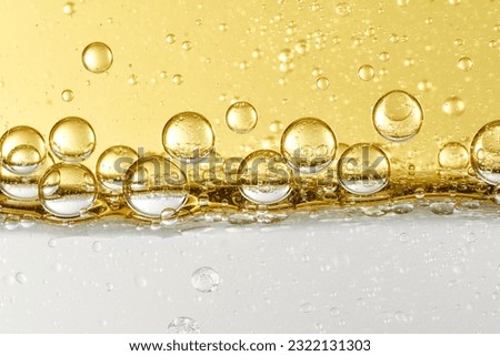 Close up of essence liquid lotion bubble layered skin care product raw materials