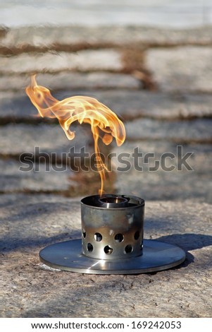 Close up of Eternal Flame at John F. Kennedy's grave in Arlington National Cemetery