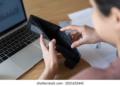 Close Up Of Ethnic Woman Pay Bills Online On Computer Check Wallet Have No Money Left On Account. Unhappy Indian Female Stressed With Bankruptcy Debt Shopping On Internet. Bankrupt Concept.