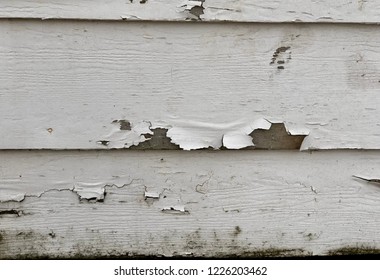 Close up of exterior peeling paint - in need of painting contractor