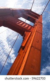 A Close Extreme Angle Perspective Of The South Tower Of The Golden Gate Bridge Support On A Sunny Day In San Francisco Looking Up From Below. Vertical