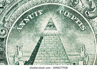Close up of the Eye of Providence on a old worn US one dollar bill.