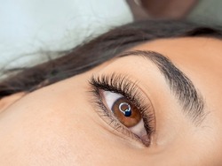 Close Up Of Eyelash Extensions In Beauty Salon Macro Eye. High Quality Photo