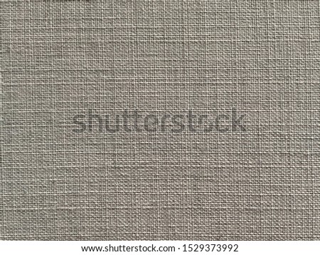 close up of fabric texture in a cross hatched pattern