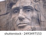 The close up face of Abraham Lincoln on Mount Rushmore