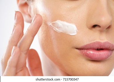 Close Up Of The Face Of A Beautiful Girl With Perfect Skin And Clean All Impurities Thanks To Moisturizing Creams Both Anti-aging And Night And Day. Concept Of Beauty, Creams,skincare And Clear.