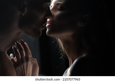 Close up face of a beautiful young couple in love embracing, romance and and affection. Sensual couple kiss. I love you. Romantic and love.