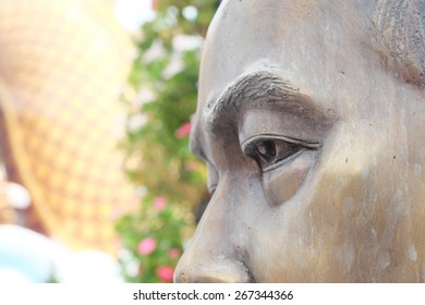 Close up face of Buddhist saint statue,lateral side