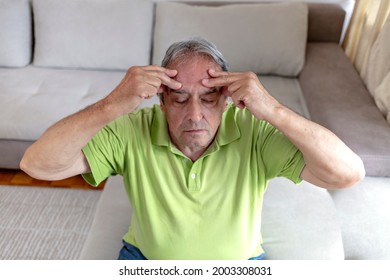 Close Up Face Of Elderly 70s Man Massaging Temples Closed Eyes Reduces Intense Intermittent Throbbing Headache Chronic Terrible Migraine, Hormonal Imbalance, High Blood Pressure Hypertension Concept.