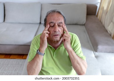 Close Up Face Of Elderly 70s Man Massaging Temples Closed Eyes Reduces Intense Intermittent Throbbing Headache Chronic Terrible Migraine, Hormonal Imbalance, High Blood Pressure Hypertension Concept.