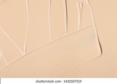 Close up of face liquid foundation texture. Cosmetic background isolated on white