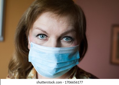 Close Up Face Middle Aged Woman Wearing Medical Facial Mask To Prevent Virus Or Disease From The Air. 