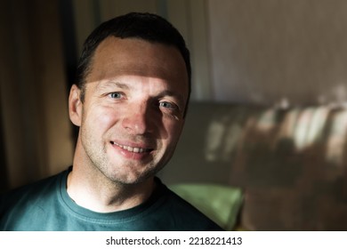 Close Up Face Portrait Of Smiling Young Adult Caucasian Man, Studio Photo With Selective Soft Focus