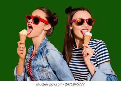 Close up face portrait of two brunette hair dreamy charming lovely cute gorgeous lady in glasses spectacles isolated on yellow vivid background eating sugar tasty yummy appetiser snack - Powered by Shutterstock