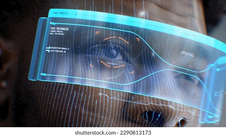 Close up face portrait of young African American man with focused look. 3D animation of human futuristic AI virtual face scanning. Identification for access. Privacy and modern recognition technology.