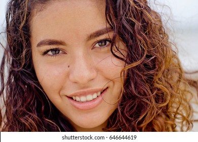 Close Up Face Shot Of A Young Mexican Woman Looking At The Camera.