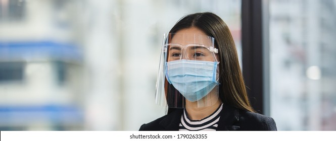 Close Up Face Woman Wearing Medical Mask And Face Shield Protect Against Airborne Disease For Prevent Infection Coronavirus Covid 19.