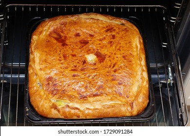 Close Up Of Failed Meat Pie In The Oven. Textured Burnt Pie Crust. Cooking Problems. Bad Mistress