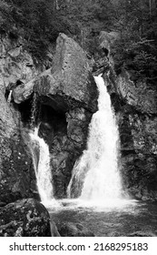 Close up of the falls as the water thunders down the mountain in black and white