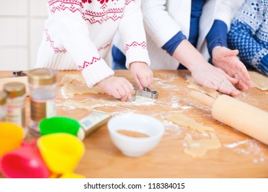 Close Up Of A Family Baking Cookies