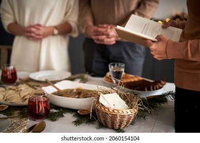 Close up of family praying in Christmas Eve                              