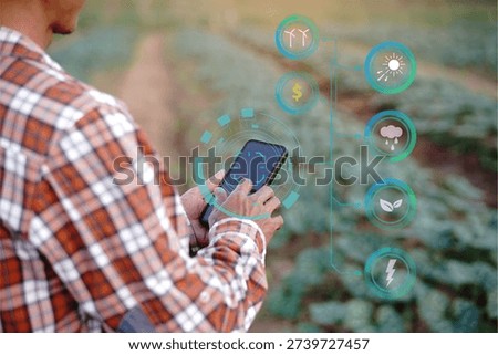 Close up of farmer hands using smartphone with futuristic digital interface for smart agriculture management and weather monitoring in organic farm.