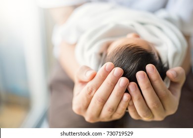 Close up father hands holding newborn baby, copy space background banner family concept