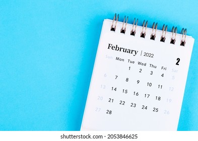 close up the February 2022 desk calendar on blue background.