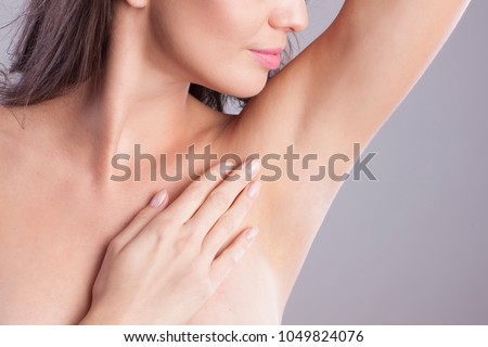 Close up of female armpit. Model touching her axilla.
