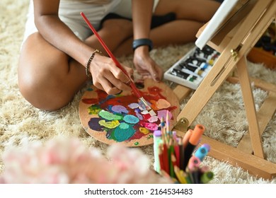 Close Up Of Female Artist Enjoy Her Color Plate On Creative Painting Brush. Indoor Home Interior For Handmade Crafts.