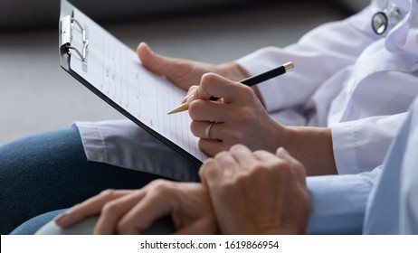 Close Up Female Doctor Filling Older Patient Checkup Form, Writing In Documents, Medical History Or Anamnesis, Disease Prevention, Healthcare, Health Insurance Contract, Mature Woman Checkup