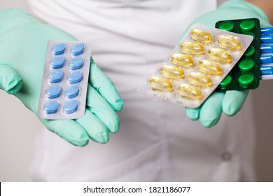 Close up of female doctor holding pill for men health - Shutterstock ID 1821186077