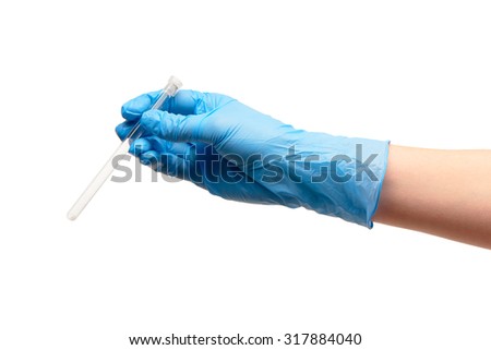 Close up of female doctor's hand in blue sterilized surgical glove holding transparent white glass ampoule with a drug against white background