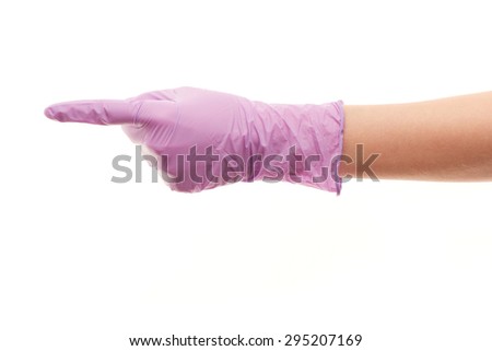 Close up of female doctor's hand in purple sterilized surgical glove pointing on something against white background