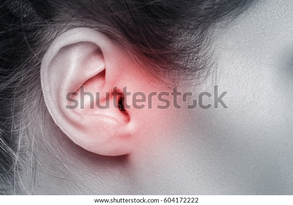 Close up of female\
ear with source of pain