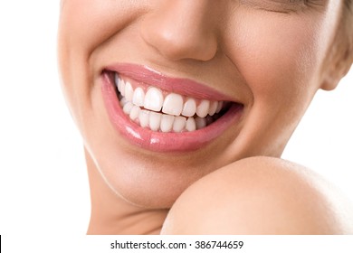 Close Up Of A Female Face With A Clean White Teeth Smiling And Being Expressive Wearing Soft Pink Lipstick Gloss