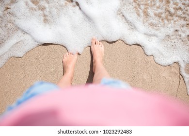 Close up of female feet on white sandy beach - Shutterstock ID 1023292483