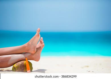 Close Up Of Female Feet On White Sandy Beach