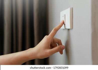 Close up of Female finger is turn off on lighting switch at home. Power, Energy, Saving Electrical, Copy space.  - Shutterstock ID 1792831099