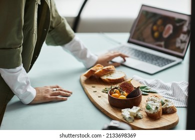 Close Up Of Female Food Photographer Using Laptop While Working In Studio, Digital Creator Concept, Copy Space