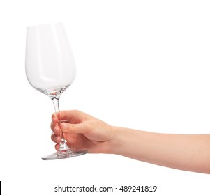 Close Up Of Female Hand Holding Empty Clean Transparent Wine Glass Against White Background. Clipping Path For Glass Border Included.