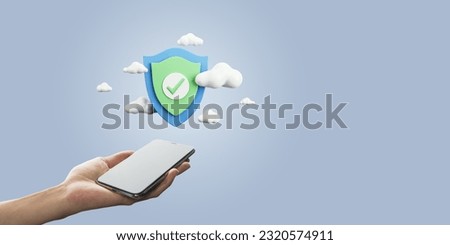 Close up of female hand holding mobile phone with digital shield and clouds on light blue background with binary coding and mock up place. Secure online payment and data guard concept