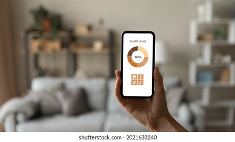 Close Up Female Hand Holding Smartphone With White Blank Empty Screen Mockup, Using Smart House Home Control System, Woman Showing Demonstrating App Or Web Service On Phone Display, Copy Space