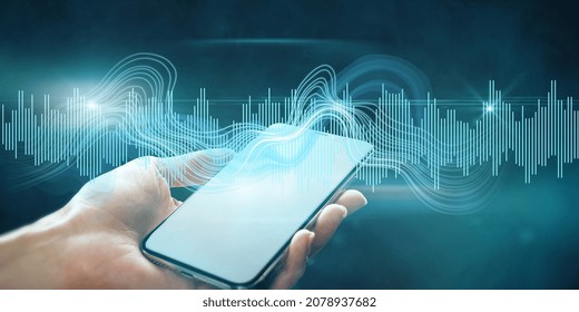 Close up of female hand holding tablet with digital sound wave on blurry background. Technology, music, frequency and energy concept. Double exposure