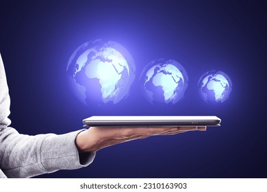 Close up of female hand using cellphone with glowing digital globe hologram on dark background. Digital world, global hacking protection and hud concept