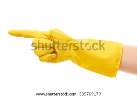Close up of female hand in yellow protective rubber glove pointing on something against white background