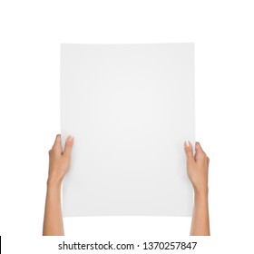 Close up of female hands holding blank paper sheet isolated on white background with copy space