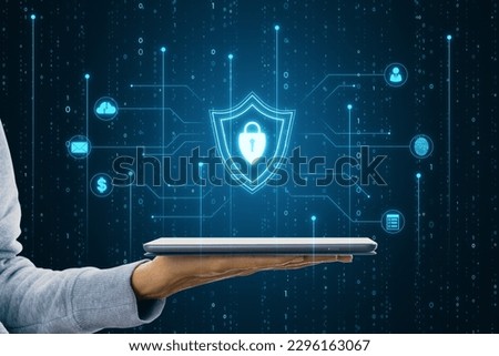 Close up of female hands holding cellphone with glowing blue padlock shield with digital coding on dark background. Safety, programming and access concept