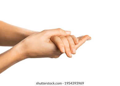 Close Up Of Female Hands Rubbing Against Each Other While Applying Lotion Over White Background. Side View Of Young Woman Applying Moisturizer Cream Or Hand Sanitizer Isolated On White Background.